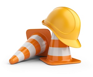 2 orange traffic cones and a yellow hard hat